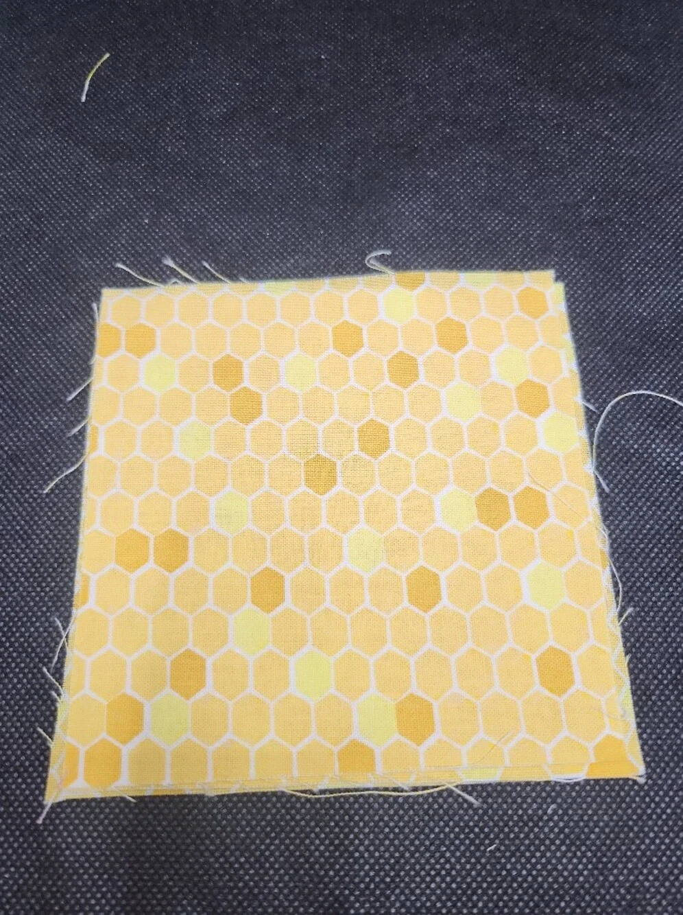 Three 4.50 inch precut cotton fabric squares